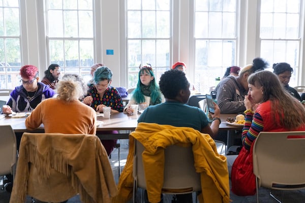 Attendees share a meal at a Friendsgiving Potluck hosted by Southern Fried Queer Pride at Neighborhood Church in Atlanta, GA, on Sunday, November 20, 2022.(Photo/Jenn Finch)