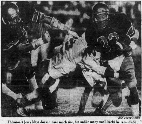 Jerry Mays, pictured in a 1984 AJC article, runs for yardage in a game for Thomson, the team he led to the Class 3A championship.