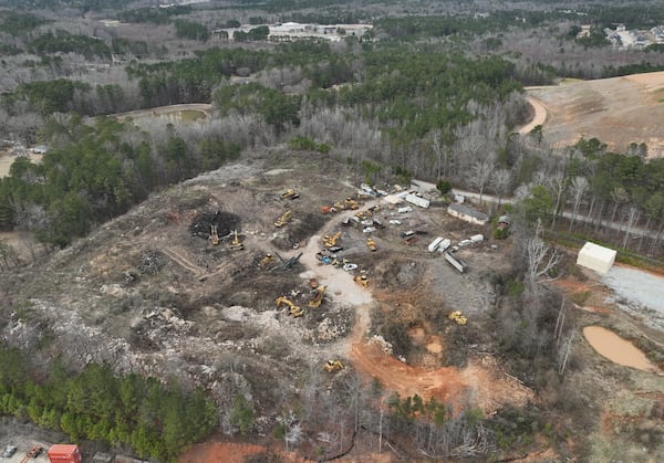 Aerial photo shows an illegal landfill that has been a nuisance in this community for years and where waste is periodically burned, raising concerns about air pollution levels, Friday, Feb. 10, 2023, in Fairburn. For years, former City of South Fulton Councilwoman Naeema Gilyard and other neighbors have been concerned about breathing smoke from the landfill, not to mention emissions from the steady stream of diesel big rigs that coming and going from warehouses that line South Fulton Parkway. Even with modern engines and cleaner fuel, exhaust from diesel trucks is known to contain a dangerous cocktail of air pollutants. (Hyosub Shin / Hyosub.Shin@ajc.com)