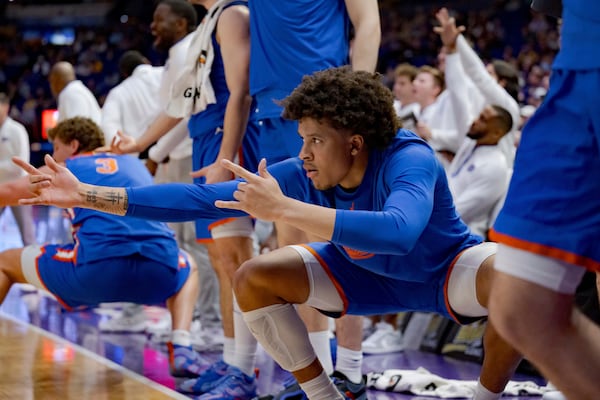 Florida guard Isaiah Brown (20) and the bench react after a teammate scores against LSU during the second half of an NCAA college basketball game in Baton Rouge, La., Saturday, Feb. 22, 2025. (AP Photo/Matthew Hinton)