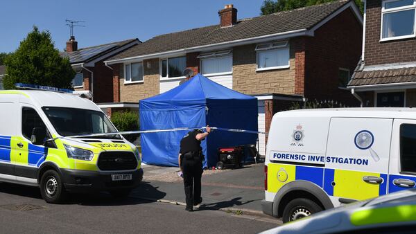 A police officer ducks under crime scene tape at 41 Westbourne Road in Chester, England, on July 3, 2018. The home is being searched following the arrest of a health care worker at the Countess of Chester Hospital. The unnamed woman was arrested on suspicion of murdering eight babies and attempting to kill six others. Cheshire police detectives have been investigating the deaths of 17 newborns and near-deaths of 15 more that occurred in the hospital’s neonatal unit between March 2015 and July 2016.