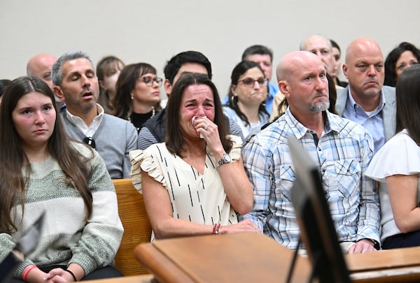 CORRECTS IDENTIFICATION TO LAKEN RILEY'S FAMILY - Allyson Phillips, second from left, mother of Laken Riley reacts as John Phillips, stepfather of Laken Riley, comforts her during a trial of Jose Ibarra, accused of killing the Georgia nursing student earlier this year, at Athens-Clarke County Superior Court, Friday, Nov. 15, 2024, in Athens, Ga. (Hyosub Shin/Atlanta Journal-Constitution via AP, Pool)