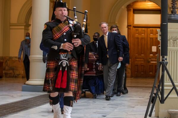 07/22/2020 - Atlanta, Georgia - A bagpiper leads the body of C.T. Vivian to the rotunda of the Georgia State Capitol building for a special service to honor his legacy, Wednesday, July 22, 2020. (ALYSSA POINTER / ALYSSA.POINTER@AJC.COM)