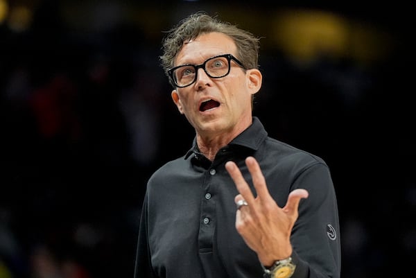 Atlanta Hawks head coach Quin Snyder reacts to play against the Philadelphia 76ers during the first half of an NBA basketball game, Monday, March 10, 2025, in Atlanta. (AP Photo/Mike Stewart)