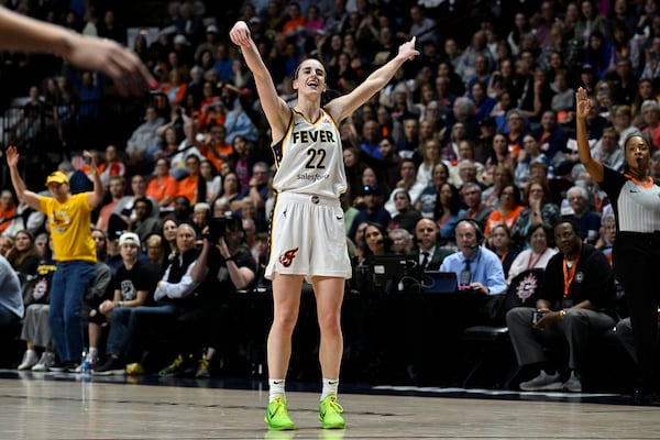 Indiana Fever guard Caitlin Clark (22) reacts after missing a 3-point shot against the Connecticut Sun during the fourth quarter of a WNBA basketball game, Tuesday, May 14, 2024, in Uncasville, Conn. (AP Photo/Jessica Hill)