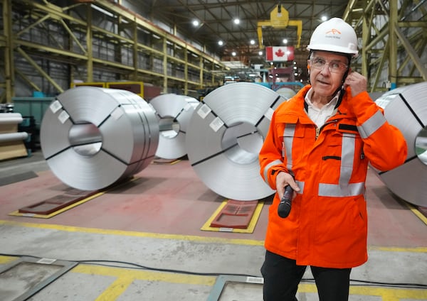 Canadian Prime Minister designate Mark Carney tours the ArcelorMittal Dofasco steel plant in Hamilton, Ontario, on Wednesday, March 12, 2025. (Nathan Denette/The Canadian Press via AP)