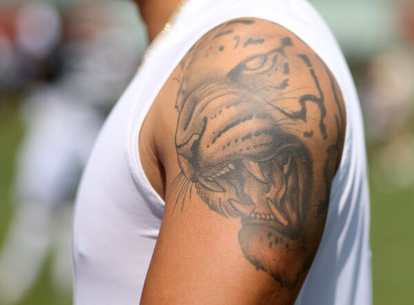 A tattoo of a Siberian Tiger is shown on the left shoulder of Atlanta Falcons Kicker Younghoe Koo. He says he didn’t have too deep of a meaning to get a tattoo. “I started looking stuff up and then matched the one that kind of makes sense for my life, I like it and then just go from there.” Koo said.  (Jason Getz / Jason.Getz@ajc.com)