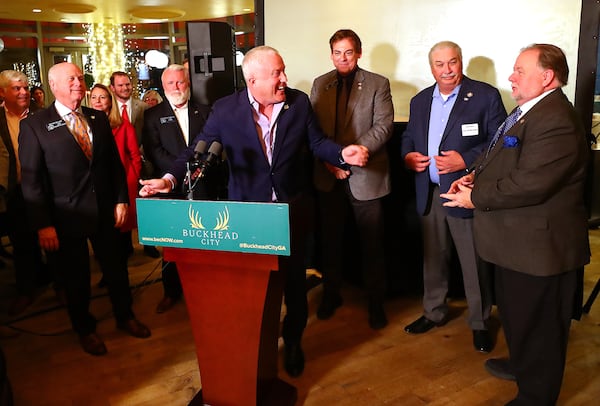 Bill White, leader of the Buckhead cityhood movement introduces, from left, state Sens. Butch Miller, Randy Robertson, Carden Summers, Lee Anderson and Jeff Mullis, who are helping carry the cityhood torch at the state Capitol, during a fundraiser last month. (Curtis Compton / Curtis.Compton@ajc.com)