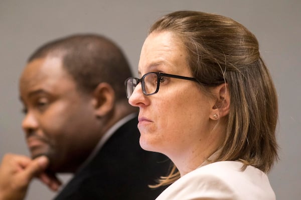 04/15/2019  -- Lawrenceville, Georgia -- Attorney Emily Gilbert (right) sits with attorney Brad Gardner (left) as they watch from the spectators section during jury selection for the trial of Tiffany Moss in front of Gwinnett County Superior Court Chief Judge George Hutchinson III at the Gwinnett County Courthouse in Lawrenceville, Monday, April 15, 2019.(ALYSSA POINTER/ALYSSA.POINTER@AJC.COM)