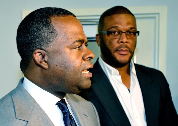 Atlanta Mayor Kasim Reed and filmmaker Tyler Perry during a meeting of the McPherson Implementing Local Redevelopment Authority.