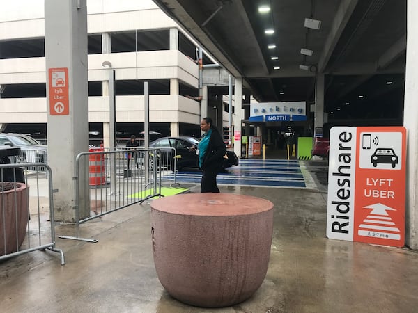 At the domestic Terminal North at Hartsfield-Jackson International Airport, after taking an escalator/elevator down to the  lower level and  exiting at lower level door LN1, signs direct passengers to the new rideshare lot to the left.