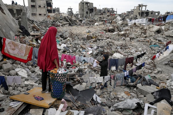 The Nijim family hangs laundry on the ruins of their property amid widespread destruction by Israeli military's ground and air offensive in Jabaliya, Gaza Strip, Feb. 18, 2025. (AP Photo/Jehad Alshrafi)