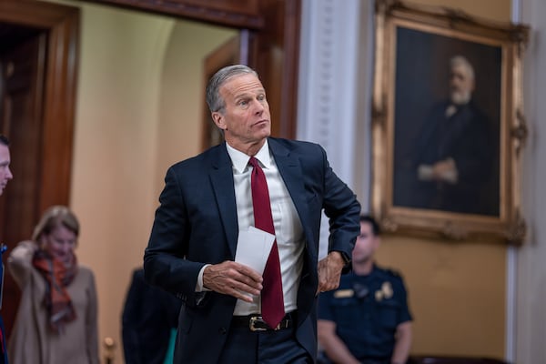 Senate Minority Whip John Thune, R-S.D., arrives to speak to reporters following a closed-door strategy session, at the Capitol in Washington, Tuesday, Dec. 17, 2024. (AP Photo/J. Scott Applewhite)