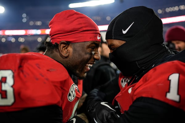 Georgia running back Nate Frazier (3) celebrates his game-winning score after eight overtimes in an NCAA college football game against Georgia Tech, Saturday, Nov. 30, 2024, in Athens, Ga. (AP Photo/Mike Stewart)