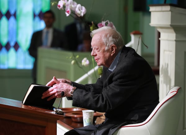 Former President Jimmy Carter, 94, the 39th U.S. president and Plains native, opens his Bible to begin the lesson as he returns to Maranatha Baptist Church to teach Sunday School less than a month after falling and breaking his hip on Sunday, June 9, 2019, in Plains.  Curtis Compton/ccompton@ajc.com