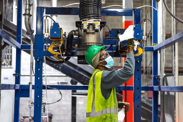 A worker is seen in Ascend Elements' facility in Covington on Tuesday, March 28, 2023. (Arvin Temkar/The Atlanta Journal-Constitution/TNS)