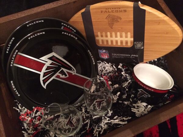  Falcons-branded cookware, drinkware, and serving pieces such as a football-shaped cutting board are available at NFLShop.com and at select Bed Bath & Beyond locations.