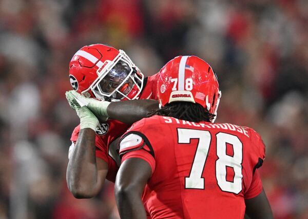 Georgia defensive lineman Zion Logue (96) and Georgia defensive lineman Nazir Stackhouse (78) celebrate during the first half in an NCAA football game at Sanford Stadium, Saturday, November 11, 2023, in Athens. (Hyosub Shin / Hyosub.Shin@ajc.com)