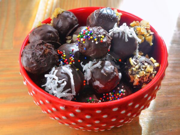 Panettone Truffles are made with crumbs of traditional Italian sweet bread, milk, cream cheese and sugar, then shaped and covered in chocolate. (Styling by Caterina Scarano / Chris Hunt for the AJC) 