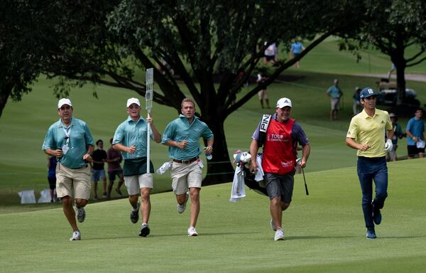 Joaquin Niemann runs toward the 18th green as he sets the speed record at the East Lake Golf Club during the final round of the PGA Tour Championship on Sunday, Sept. 5, 2021, at East Lake Golf Club in Atlanta. (Ben Gray/For the AJC)