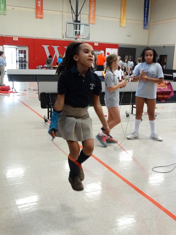 Ava jump ropes during the event at Woodward Academy. CREDIT: Rodney Ho/ rho@ajc.com