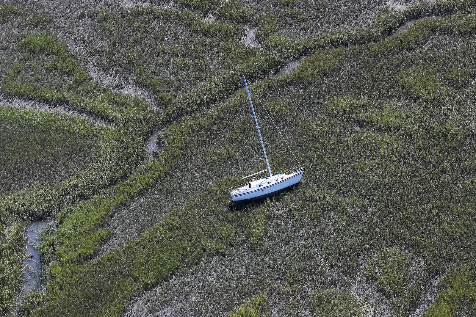 A sailboat has been blown lose from itâ€™s harbor anchor into the marsh at Shelman Bluff just south of Harris Neck along the Georgia coast in the aftermath of Hurricane Matthew on Sunday, Oct. 9, 2016. Curtis Compton /ccompton@ajc.com