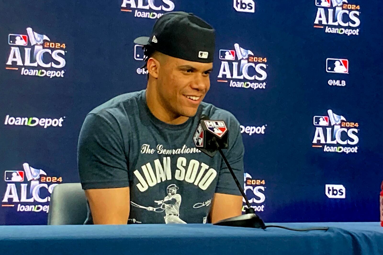 Juan Soto speaks in the Yankee Stadium news conference room after hitting a go-ahead home run in a win over Cleveland in the AL Championship Series opener on Monday, Oct. 14, 2024, in New York. (AP Photo/Ron Blum)