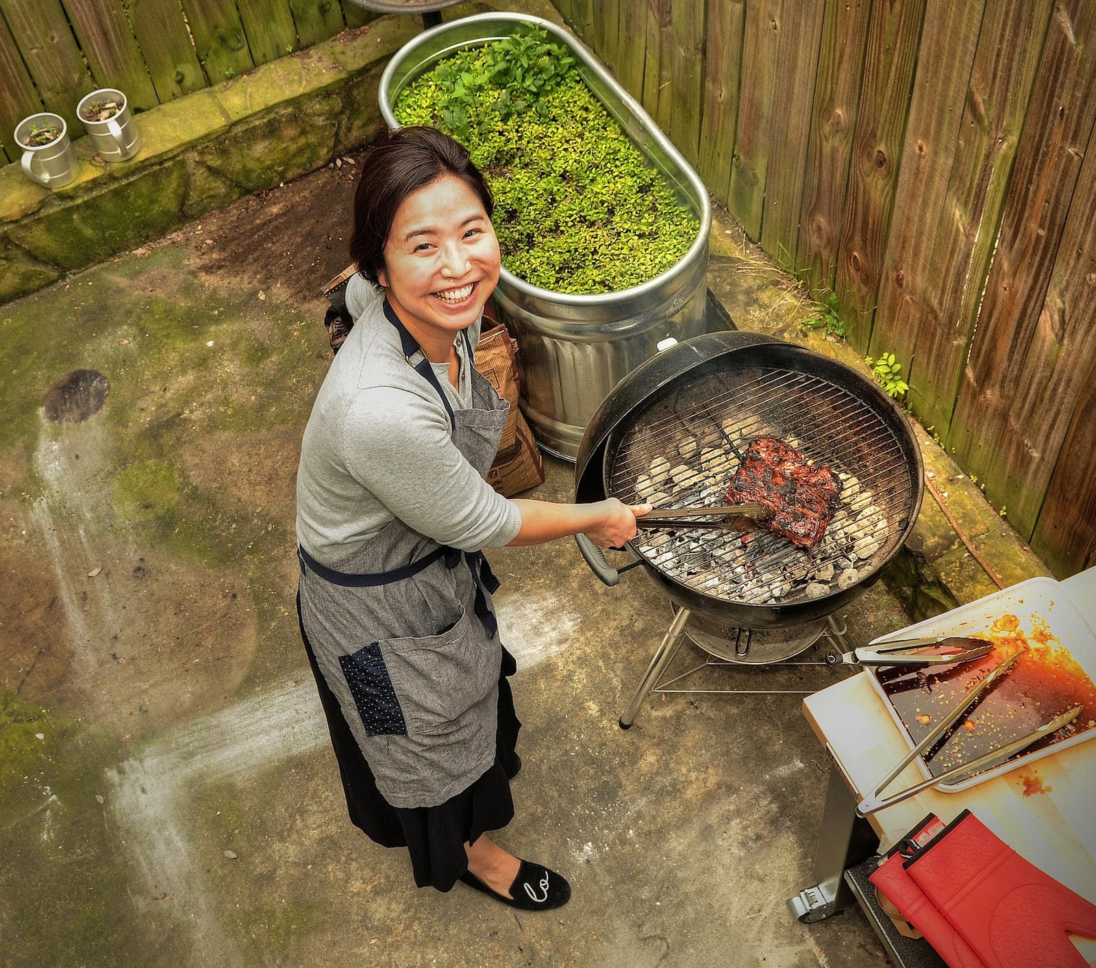 Seung Hee Lee cooks on her back porch grill. (Photo by Chris Hunt/Special; styling by Seung Hee Lee.