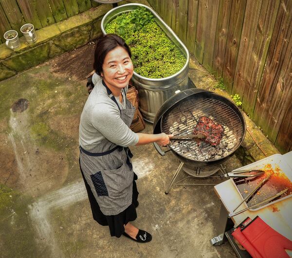 Seung Hee Lee cooks on her back porch grill. (Photo by Chris Hunt/Special; styling by Seung Hee Lee.