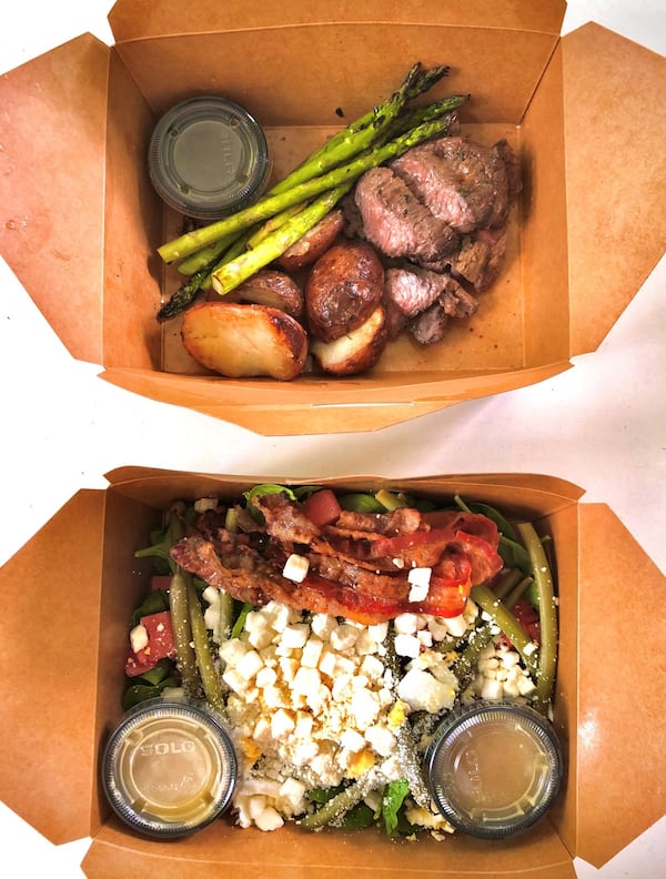 This takeout order includes the steak-frites and watermelon spinach salad from Mediterranea in Grant Park. CONTRIBUTED BY WENDELL BROCK