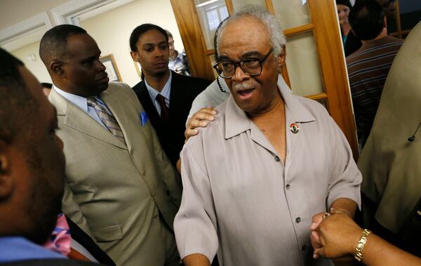 May 23, 2013 - Marietta - Family members and supporters greet Tyrone Brooks after the press conference. Former Gov. Roy Barnes holds a press conference on behalf of his latest high-profile client -- indicted state Rep. Tyrone Brooks, D-Atlanta, at his Marietta law office on Thursday. In a federal indictment, Brooks was charged with tax, wire and mail fraud. BOB ANDRES / BANDRES@AJC.COM