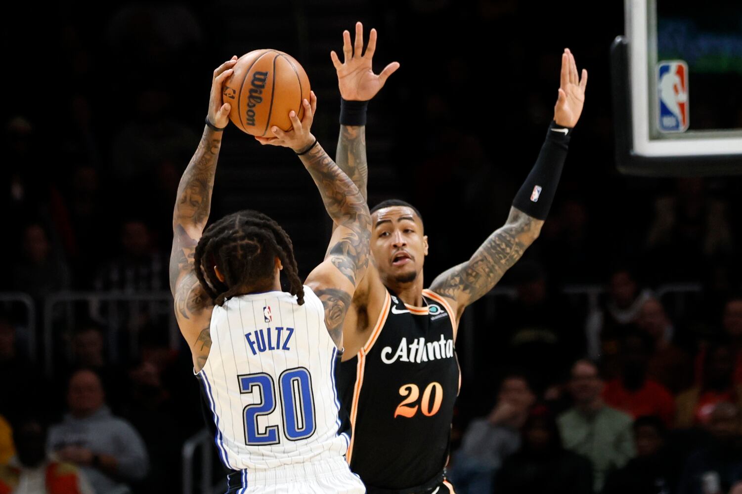 Magic guard Markelle Fultz goes up for a shot against Hawks forward John Collins during the first half Monday night in Atlanta. (Miguel Martinez / miguel.martinezjimenez@ajc.com)