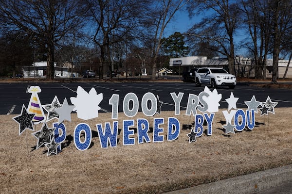 A 100-year celebration sign is displayed outside Delta Air Lines’ Customer Engagement Center in Hapeville on profit-sharing day on Friday, Feb. 14, 2025. (Natrice Miller/AJC)