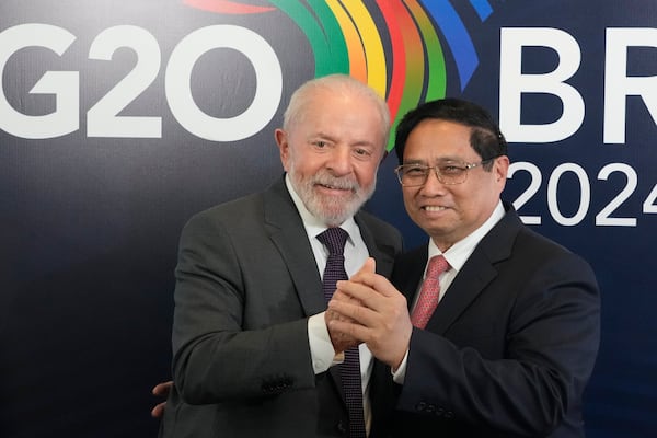 Brazil's President Luiz Inacio Lula da Silva, left, shakes hands with Vietnam's Prime Minister Pham Minh Chinh during a bilateral meeting a day before the opening of the G20 Summit, in Rio de Janeiro, Sunday, Nov. 17, 2024. (AP Photo/Eraldo Peres)