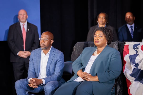 Democratic U.S. Sen Raphael Warnock and gubernatorial candidate Stacey Abrams ran vastly different campaigns this year. Abrams embraced President Joe Biden and emphasized support for liberal policies, while Warnock steered clear of the president and highlighted his work across bipartisan lines to appeal to swing voters. (Arvin Temkar/The Atlanta Journal-Constitution/TNS)