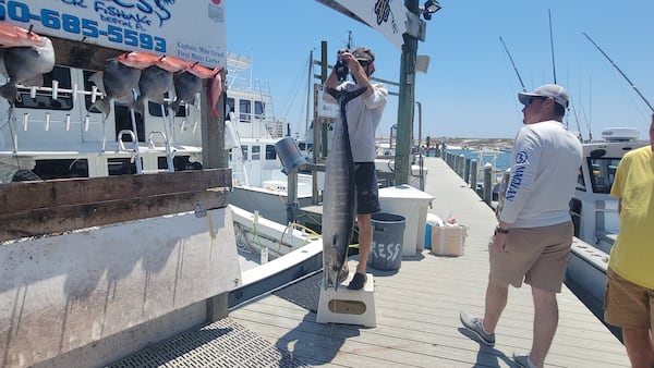 A fisherman's catch is weighed at the harbor in Destin, Florida. 
Courtesy of Wesley K.H. Teo