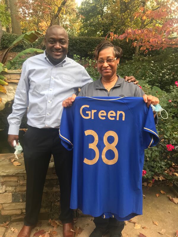 At a retirement event for Pat Green, right, who worked for 38 years as a nurse at A.G. Rhodes in Atlanta, the CEO Deke Cateau announced a symbolic retirement of a jersey to represent her contribution to the care of countless seniors at the Atlanta nursing home. (Photo courtesy of A.G. Rhodes)