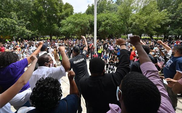 Hundreds gathered outside the Glynn County courthouse for a rally seeking justice for Ahmaud Arbery in Brunswick on Saturday, May 16, 2020. A caravan of hundreds of people left a southwest Atlanta church Saturday morning for coastal Brunswick, seeking justice in the shooting death of Ahmaud Arbery and demanding the resignations of two district attorneys. They rallied at the Glynn County Courthouse. HYOSUB SHIN / HYOSUB.SHIN@AJC.COM