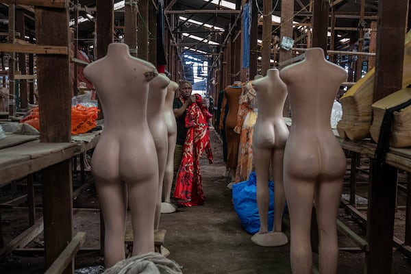 Merchants wait for customers at the Virunga market in Goma, Democratic Republic of Congo, Thursday, Feb. 27, 2025, one month after Rwanda-backed M23 rebels captured the city. (AP Photo/Moses Sawasawa)