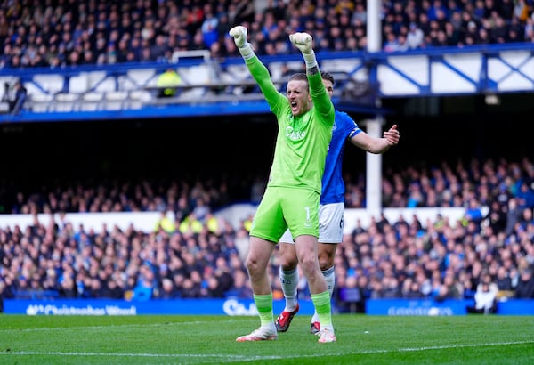 Everton goalkeeper Jordan Pickford reacts to a defensive clearance during the English Premier League soccer match between Everton and West Ham, at Goodison Park, Liverpool, England, Saturday March 15, 2025. (Peter Byrne/PA via AP)