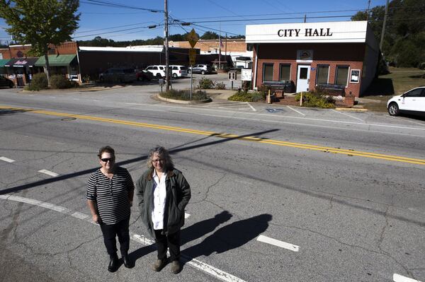 10-24-18 - Statham, GA - Catherine Corkren (left), 47, of Atlanta, Ga., and Sondra Moore, 47, of Hoschton, Ga., pose for a portrait across the road from Statham City Hall in Statham, Ga., on Wednesday, Oct. 24, 2018.  (Casey Sykes for The Atlanta Journal-Constitution)