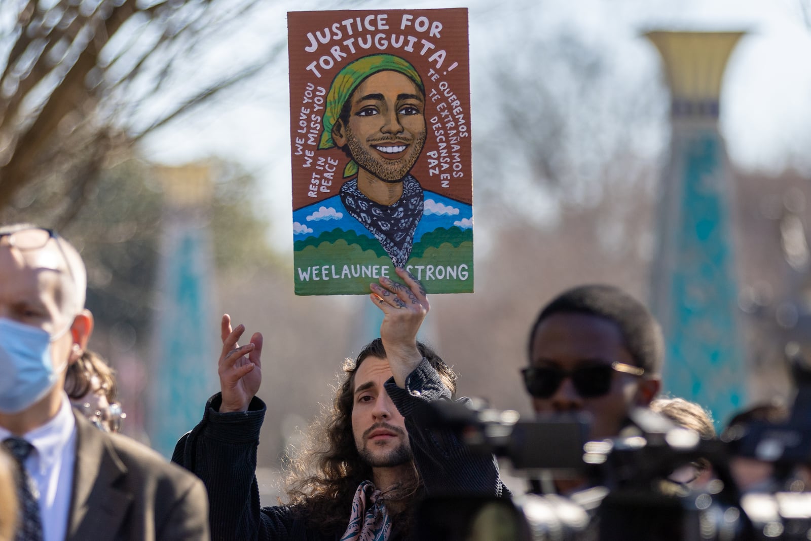 Noah Gringi holds a sign at a press conference for Manuel “Tortuguita” Teran in Decatur on Monday, February 6, 2023. Manuel Teran was killed on Jan. 18, 2023 near the site of Atlanta’s planned public safety training center. (Arvin Temkar / arvin.temkar@ajc.com)