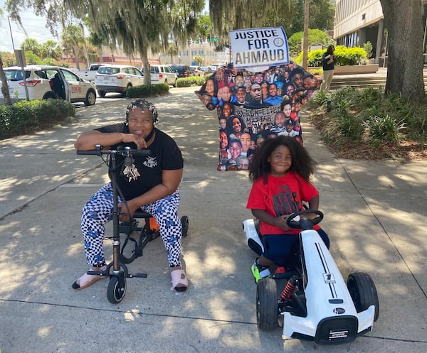 Vanessa Ward (left) and her 4-year-old grandson Kawan traveled from their northwest Atlanta home to support the Arbery family during sentencing.