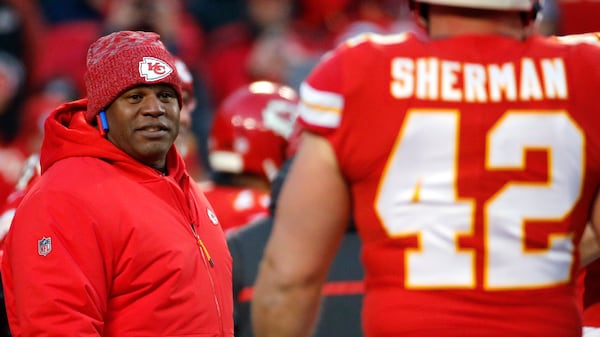 Kansas City Chiefs offensive coordinator Eric Bieniemy watches players before the team's AFC Championship game against the New England Patriots Jan. 20, 2019, in Kansas City, Mo. The Chiefs have perhaps the most dynamic offense in the NFL and the San Francisco 49ers feature one of the stingiest defenses in the league. The men in charge of the units got interviews for head coaching but were passed over. (Charlie Riedel/AP)