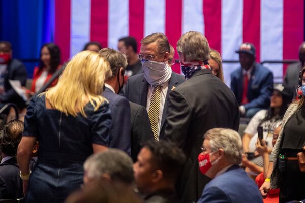 09/25/2020 - Atlanta, Georgia - Sen. Doug Collins is escorted into the ballroom with other politicians during a Blacks for Trump campaign rally at the Cobb Galleria Centre in Atlanta, Friday, September 25, 2020.  (Alyssa Pointer / Alyssa.Pointer@ajc.com)