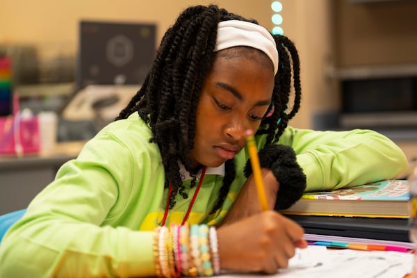 Zulu Philmore, age 11, completes a worksheet on Tuesday, Sept. 17, at Woodland Elementary in Sandy Springs, Georgia. (Olivia Bowdoin for the AJC).