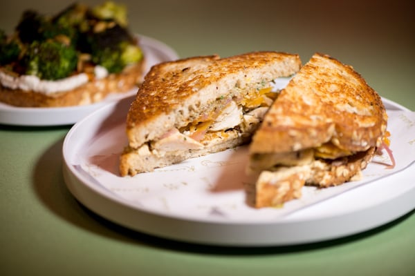  Chick Flick Sandwich with roasted chicken, hummus, walnut-raisin pesto, butternut squash, pickled red onion, and multigrain bread. Photo credit- Mia Yakel.