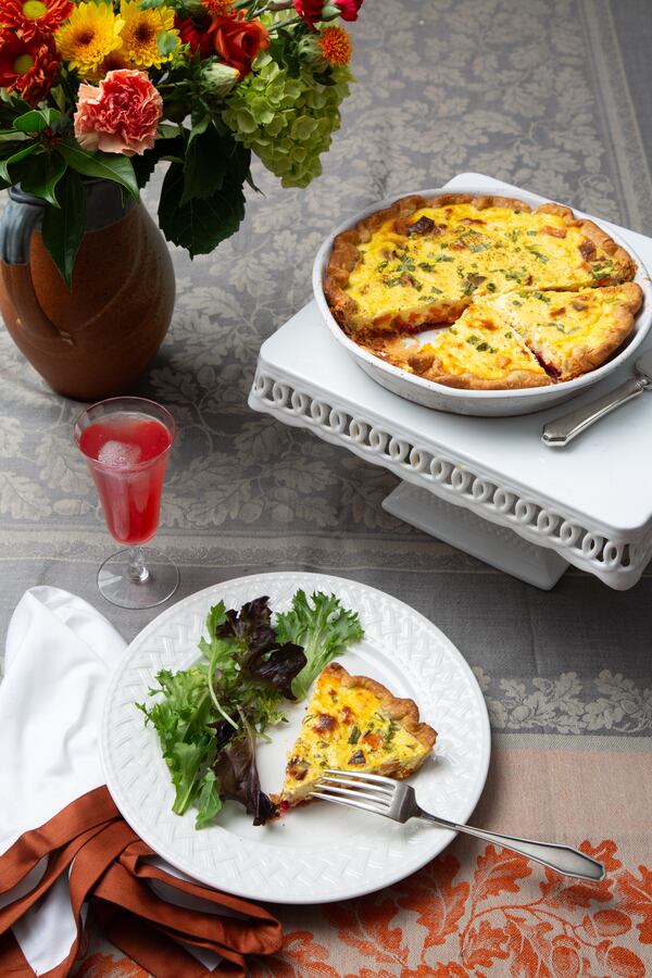 Sweet Potato and Cranberry Quiche is a little bit sweet and a little bit savory, and it can be served warm or cold. Shown with the quiche is a beverage made with Cranberry Ginger Syrup. (Styling by C.W. Cameron / Martha Williams for the AJC)