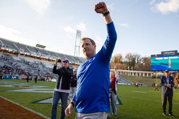 SMU head coach Rhett Lashlee celebrates after winning an NCAA college football game against Virginia Saturday, Nov. 23, 2024, in Charlottesville, Va. (AP Photo/Mike Kropf)