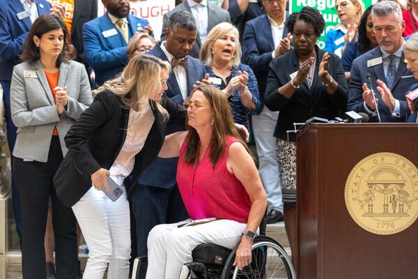 Gun violence survivor Janet Paulsen of Acworth said at a press conference Democrats held Wednesday at the Georgia Capitol that she would still be able to walk if Georgia had a "red flag" law in 2015, the year her husband shot her six times in her driveway, paralyzing her from the waist down. (Arvin Temkar / arvin.temkar@ajc.com)